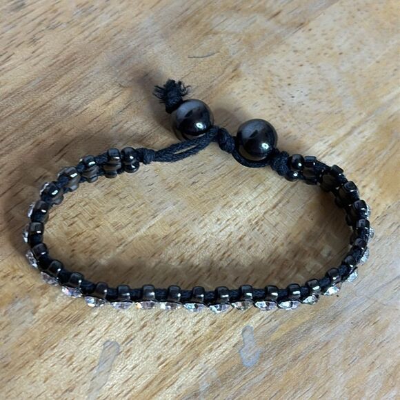 Black corded bracelet with white silver tone rhinestones with beaded closure - Picture 3 of 6